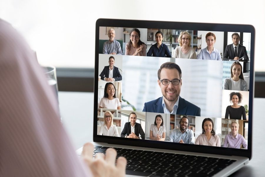 group video call on laptop with IT experts